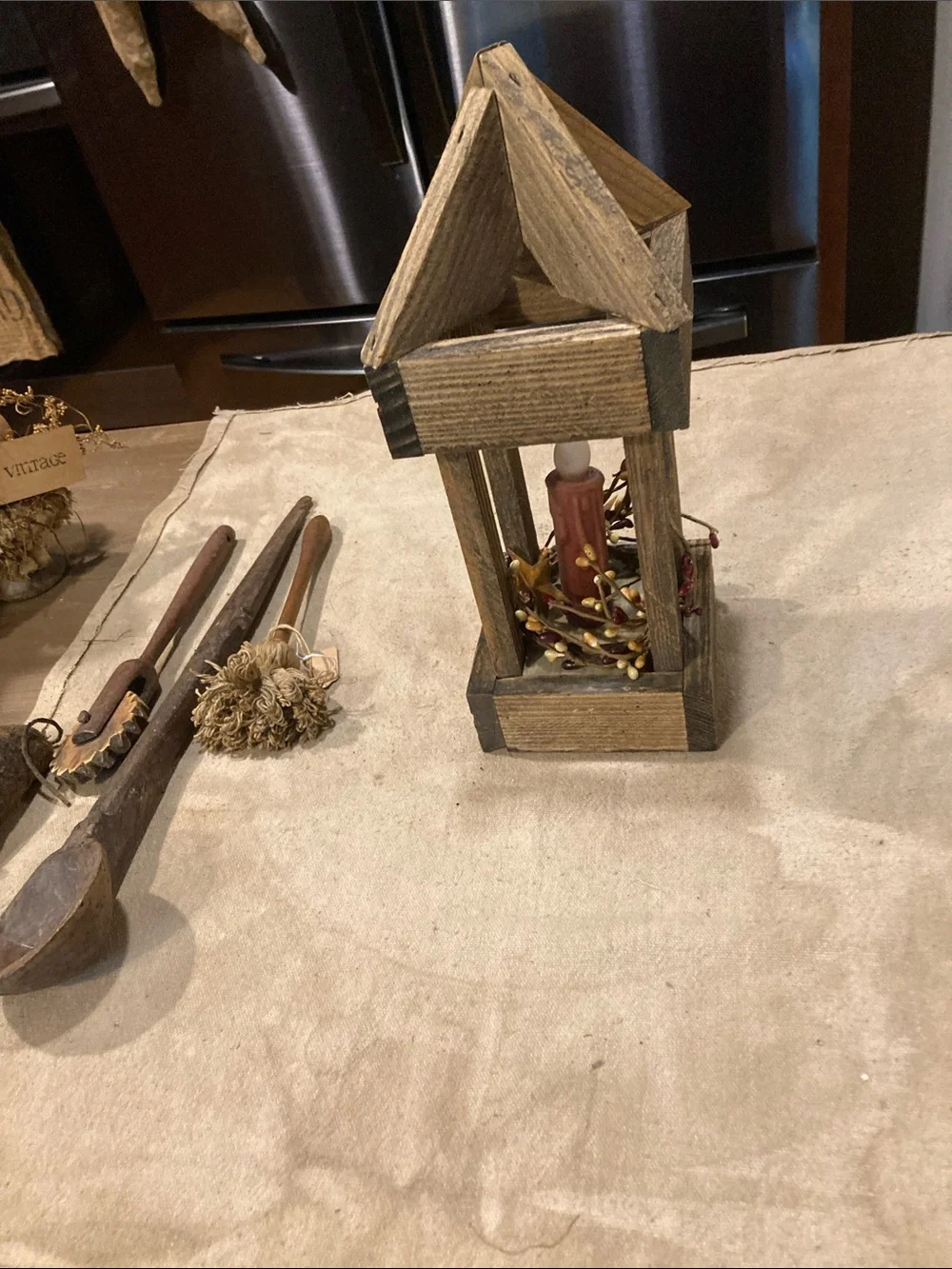 Rustic Wooden Lantern with Red Candle Accent